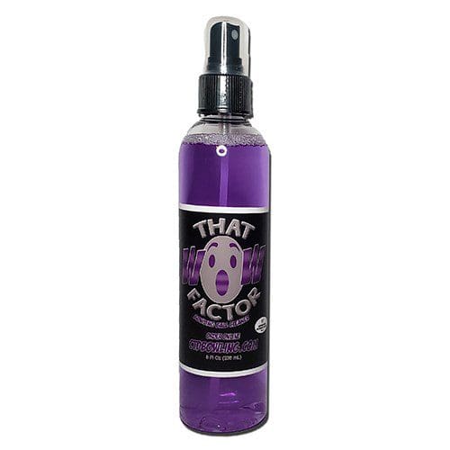 Purple spray bottle labeled "That Action" with a black cap.